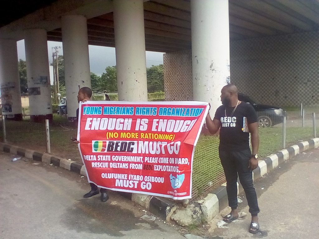 Young Nigerians blacklist BEDC at Asaba protest, urge FG to deny it license renewal for poor performance