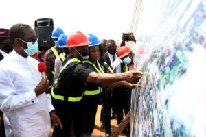 Delta Governor, Senator Dr. Ifeanyi Okowa (left), listens while the Commissioner for Works (Highways and Urban), Engr. Noel Omodon (2nd left), and the Director of Highways of the Ministry, Engr. (Mrs) Juliet Aboloje explain the structural drawing of the Koka flyover and Interchange at Ibusa/Asaba Benin Expressway under construction during the Governor’s inspection of the project in Asaba on Tuesday.