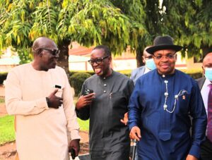 Okowa (middle); his Akwa-Ibom State counterpart, Emmanuel Udom (right), and the Chairman, PDP, Delta State, Barr. Kingsley Esiso