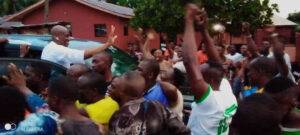 Elumelu acknowledging cheers from supporters.