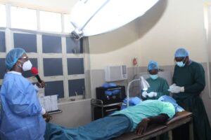 Theatre room where physicians are at work on a beneficiary of the free eye surgery. Looking on is Dame Okowa, left. Photos: Norbert Amede
