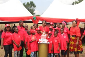 World Sickle Cell Day with Dame Okowa with children cut the cake.