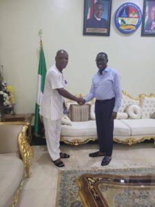 Delta Governor, Senator (Dr) Ifeanyi Okowa, right, with Mr. Iwemdi Nwaham.