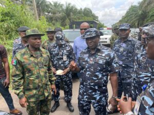 CP Ari M. Ali with Military officers at the Owa Oyibu railway station.
